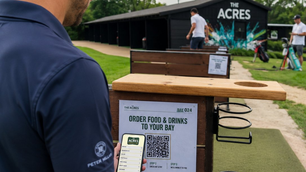Golfer at Bay 024 scanning a QR code to order food and drinks to their driving range bay at The Acres
